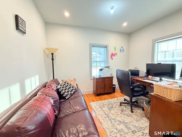 a workspace with furniture and a window