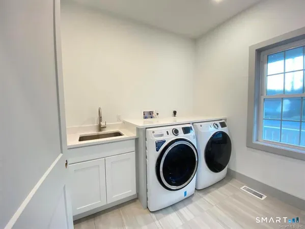 a utility room with dryer and washer