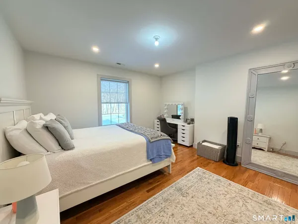 a bed room with a bed and dresser