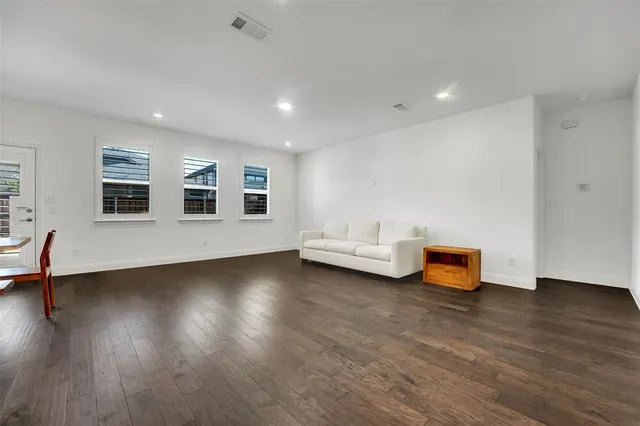 a view of a livingroom with furniture and wooden floor