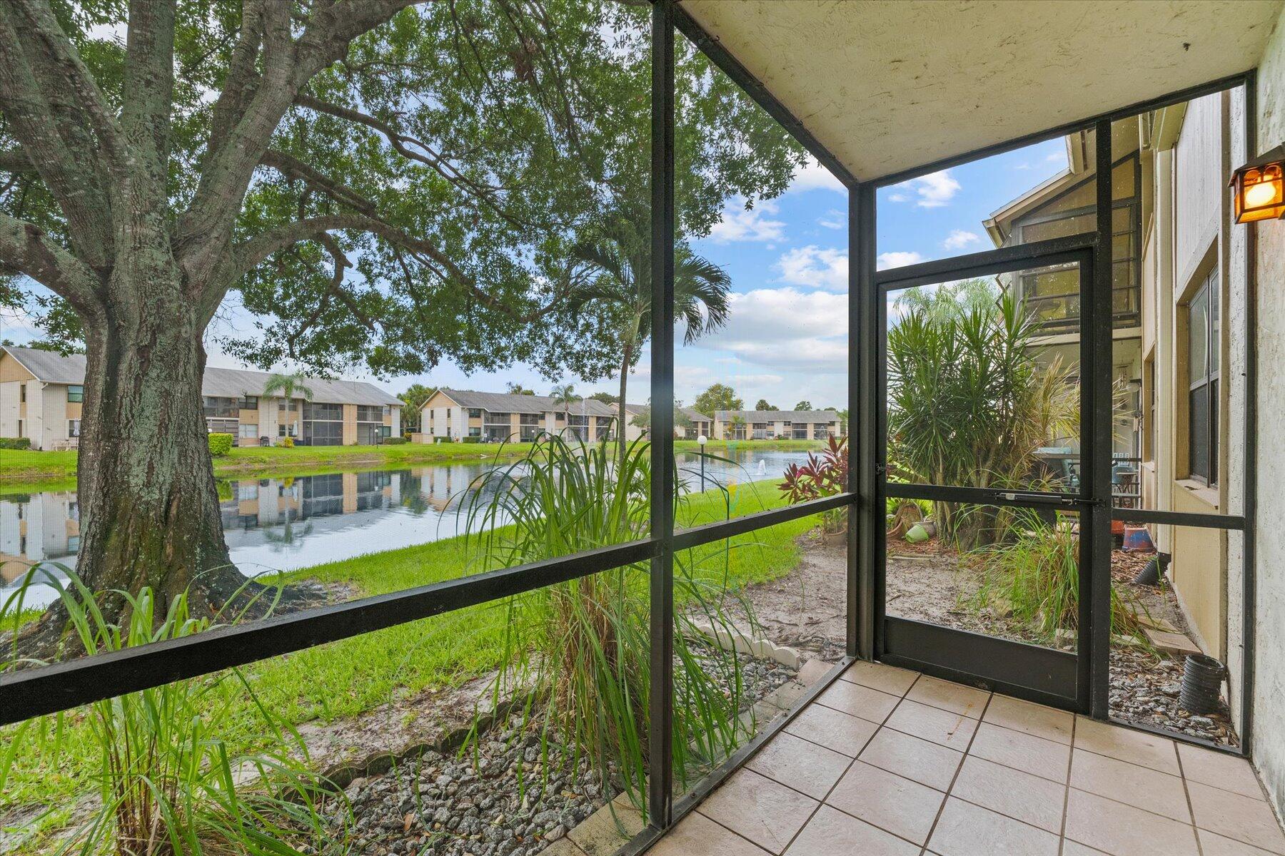 3151 Southeast Aster Lane, Unit 1302 Stuart, FL 34994 - Photo 1 of 23 a view of a street from a balcony
