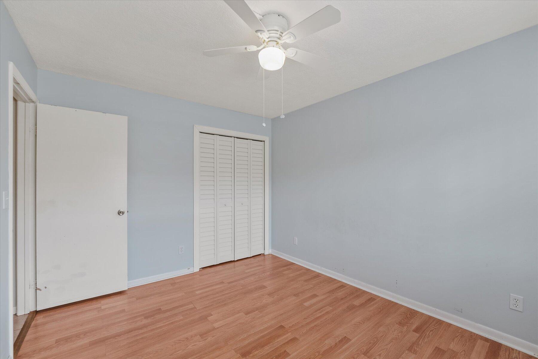 3151 Southeast Aster Lane, Unit 1302 Stuart, FL 34994 - Photo 19 of 23 a view of empty room with wooden floor