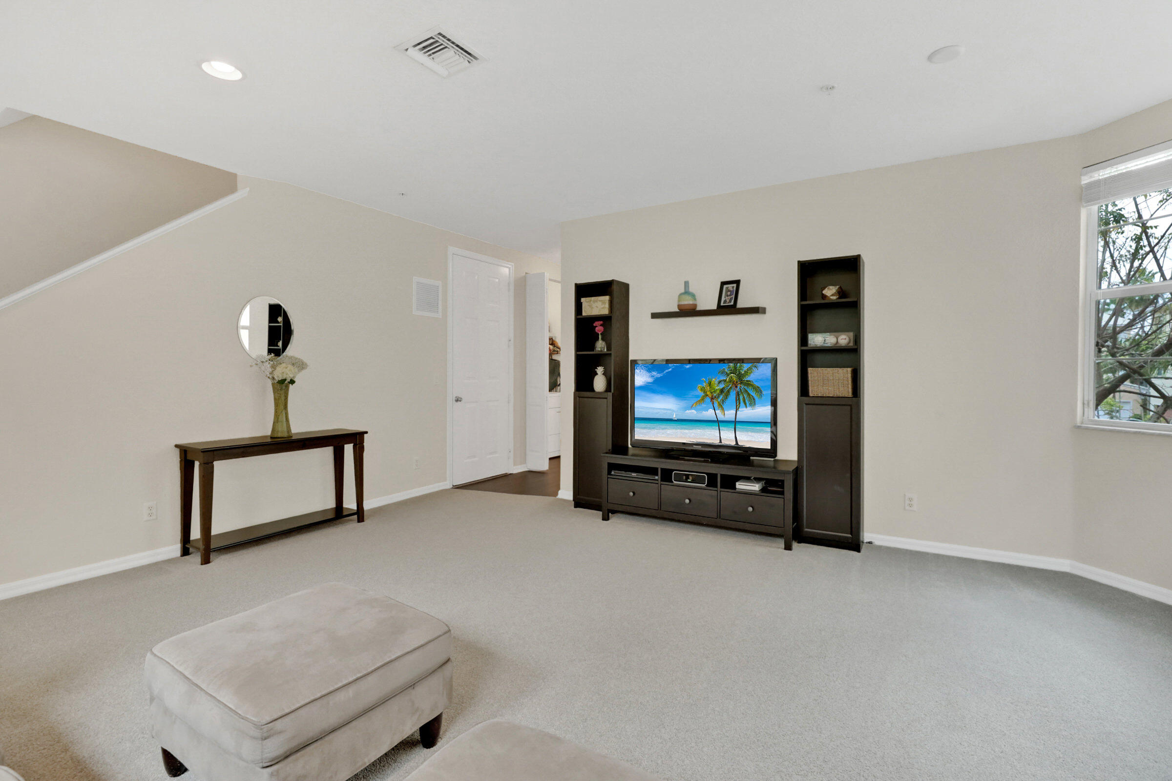 1582 Grande Cull Way Jupiter, FL 33458 - Photo 11 of 75 a living room with furniture and a flat screen tv
