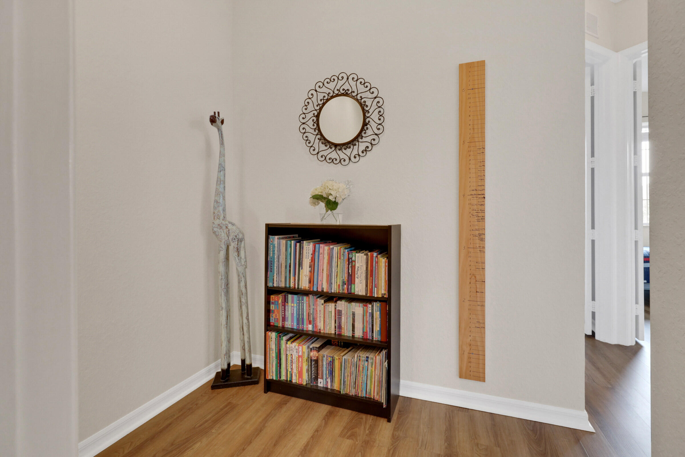 1582 Grande Cull Way Jupiter, FL 33458 - Photo 23 of 75 a view of a room with wooden floor and small window