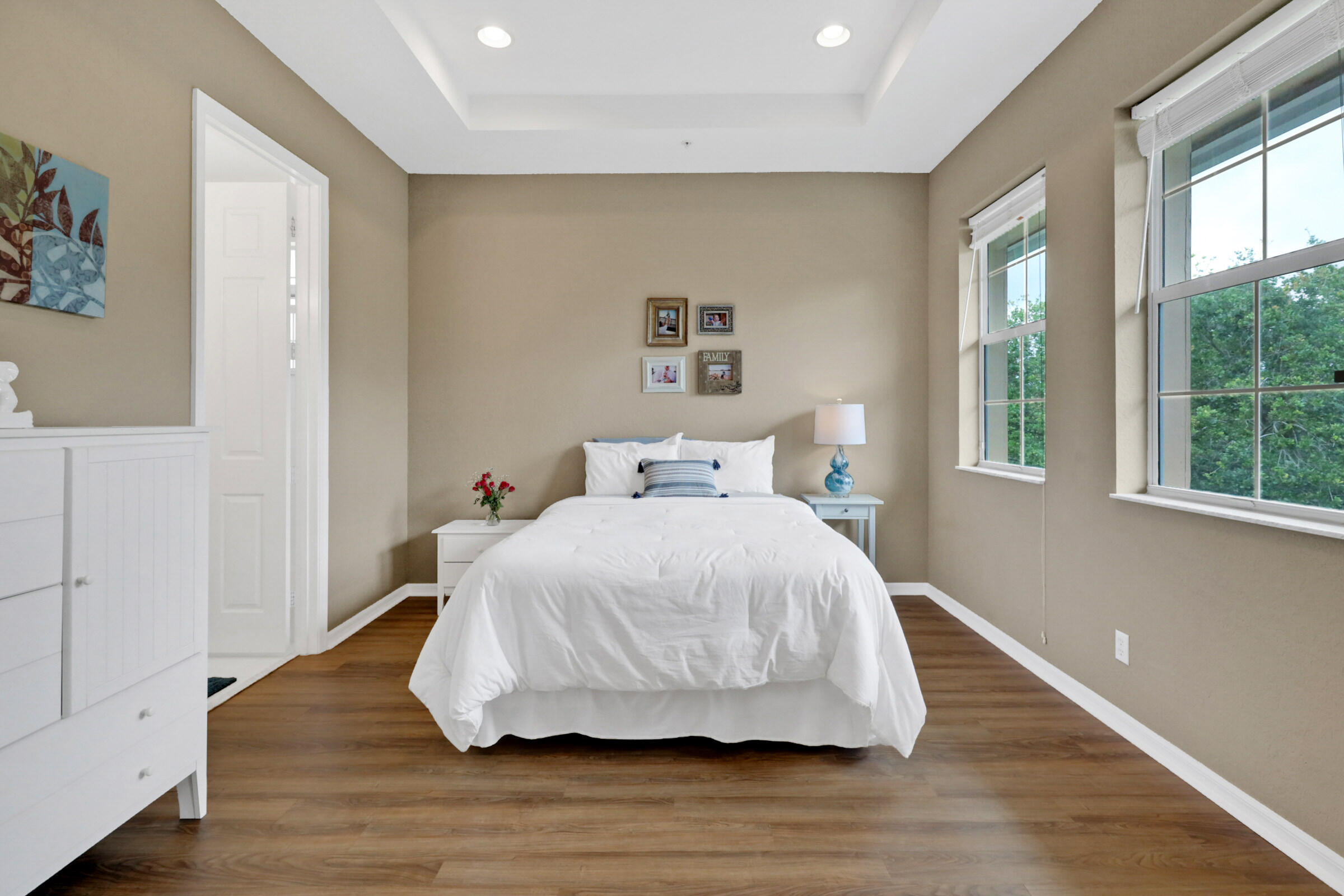 1582 Grande Cull Way Jupiter, FL 33458 - Photo 25 of 75 a bedroom with a bed and wooden floor