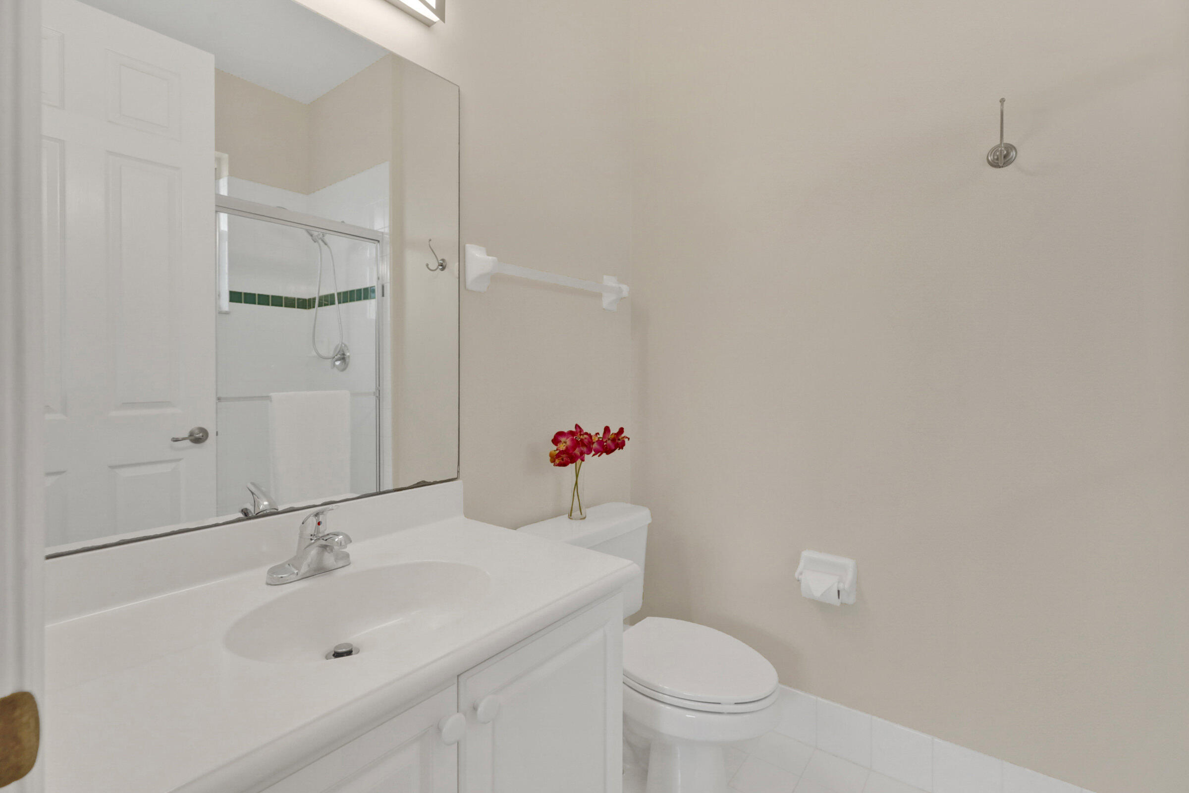 1582 Grande Cull Way Jupiter, FL 33458 - Photo 30 of 75 a bathroom with a sink and a mirror