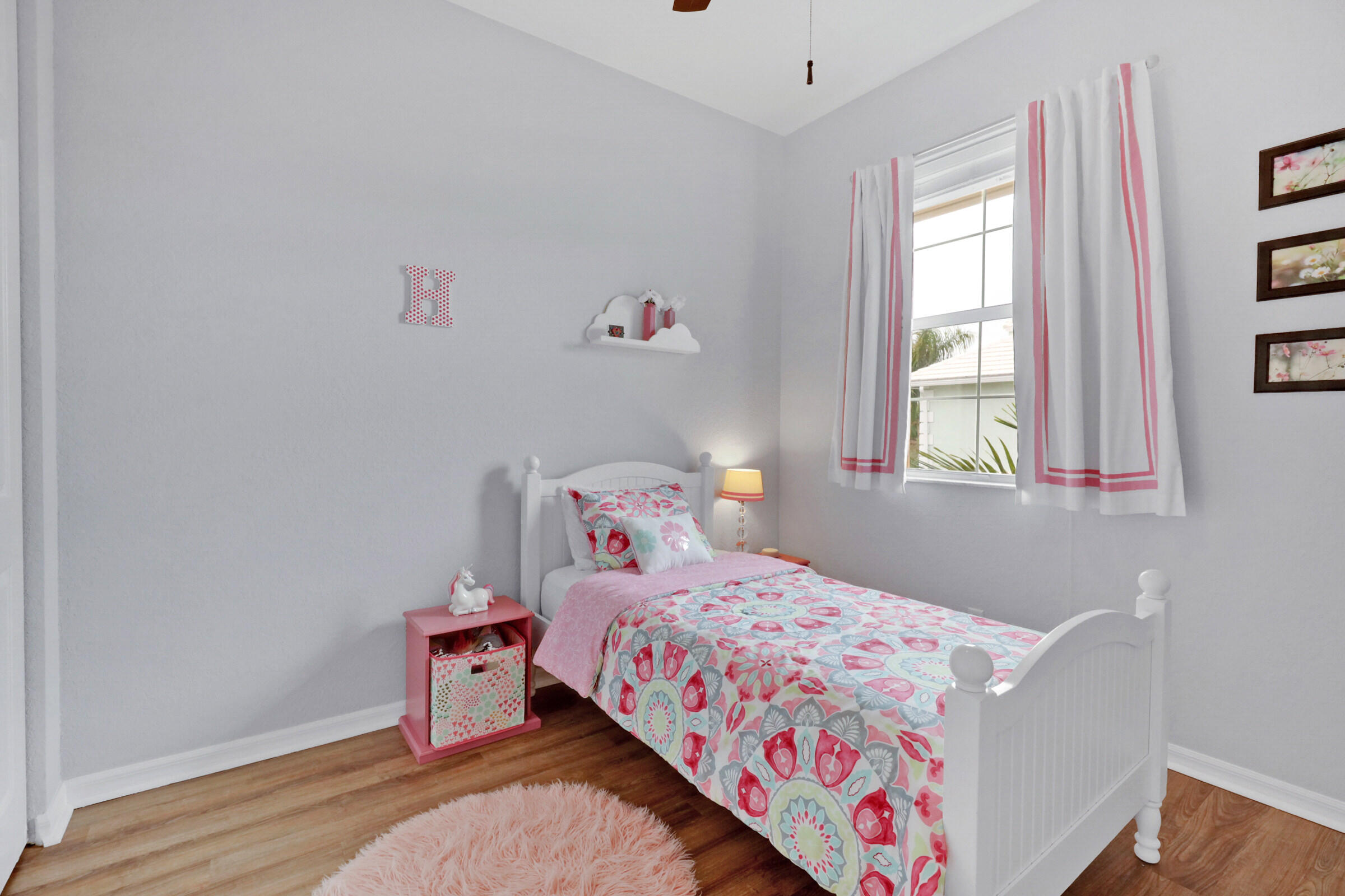 1582 Grande Cull Way Jupiter, FL 33458 - Photo 31 of 75 a bedroom with a bed and a window