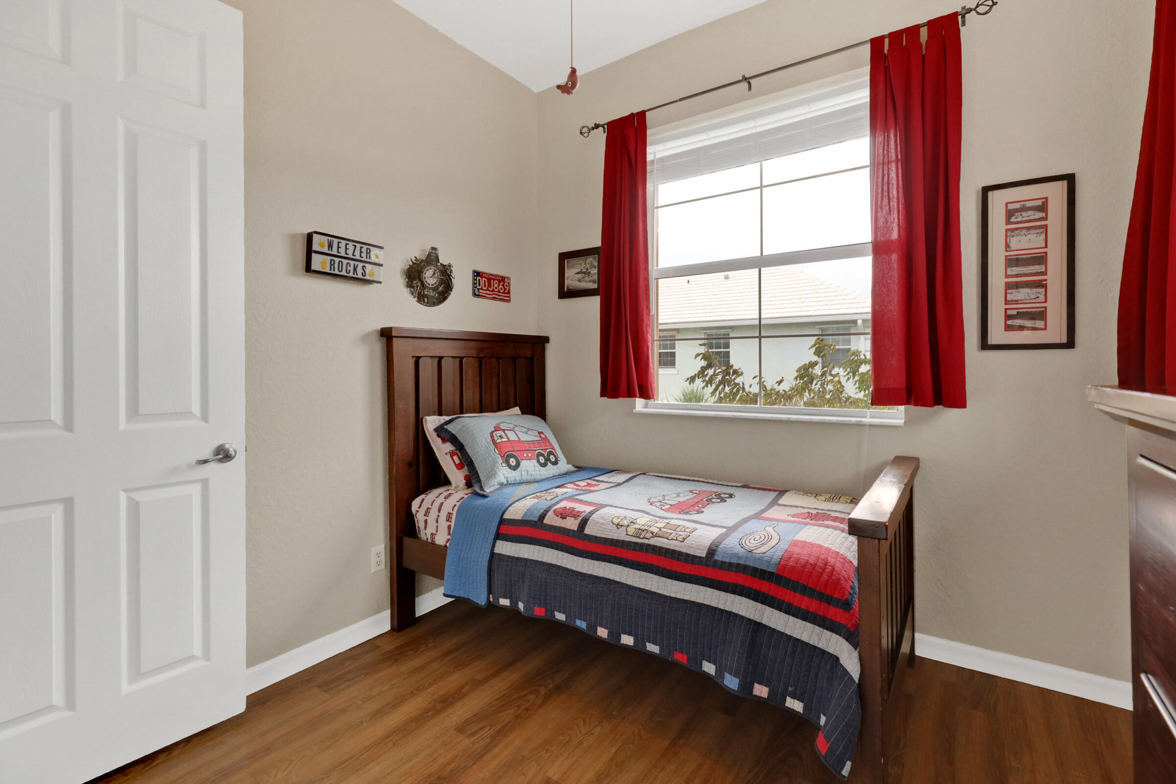 1582 Grande Cull Way Jupiter, FL 33458 - Photo 33 of 75 a bedroom with a bed and a window with chair