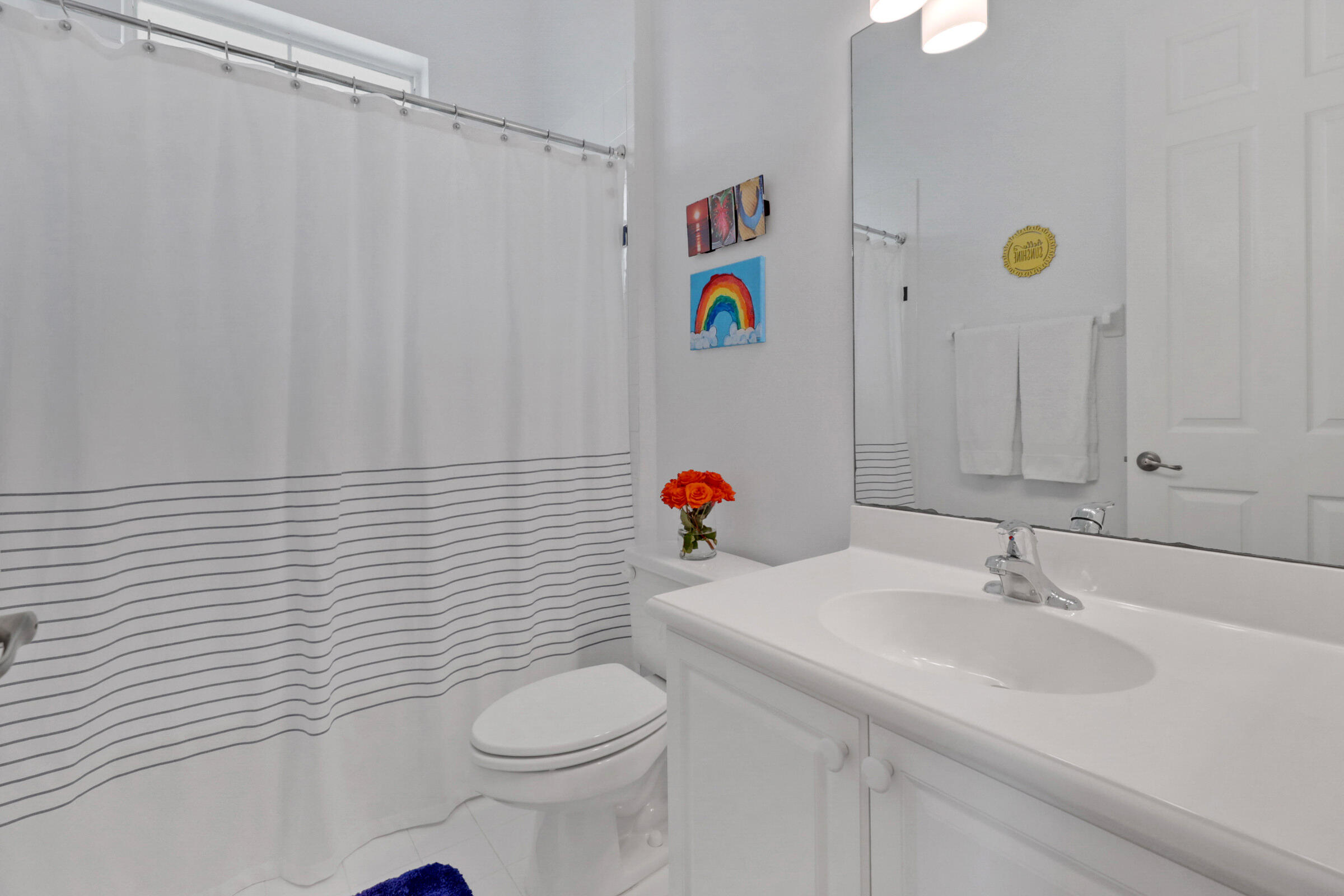 1582 Grande Cull Way Jupiter, FL 33458 - Photo 35 of 75 a bathroom with a sink a toilet and shower curtain