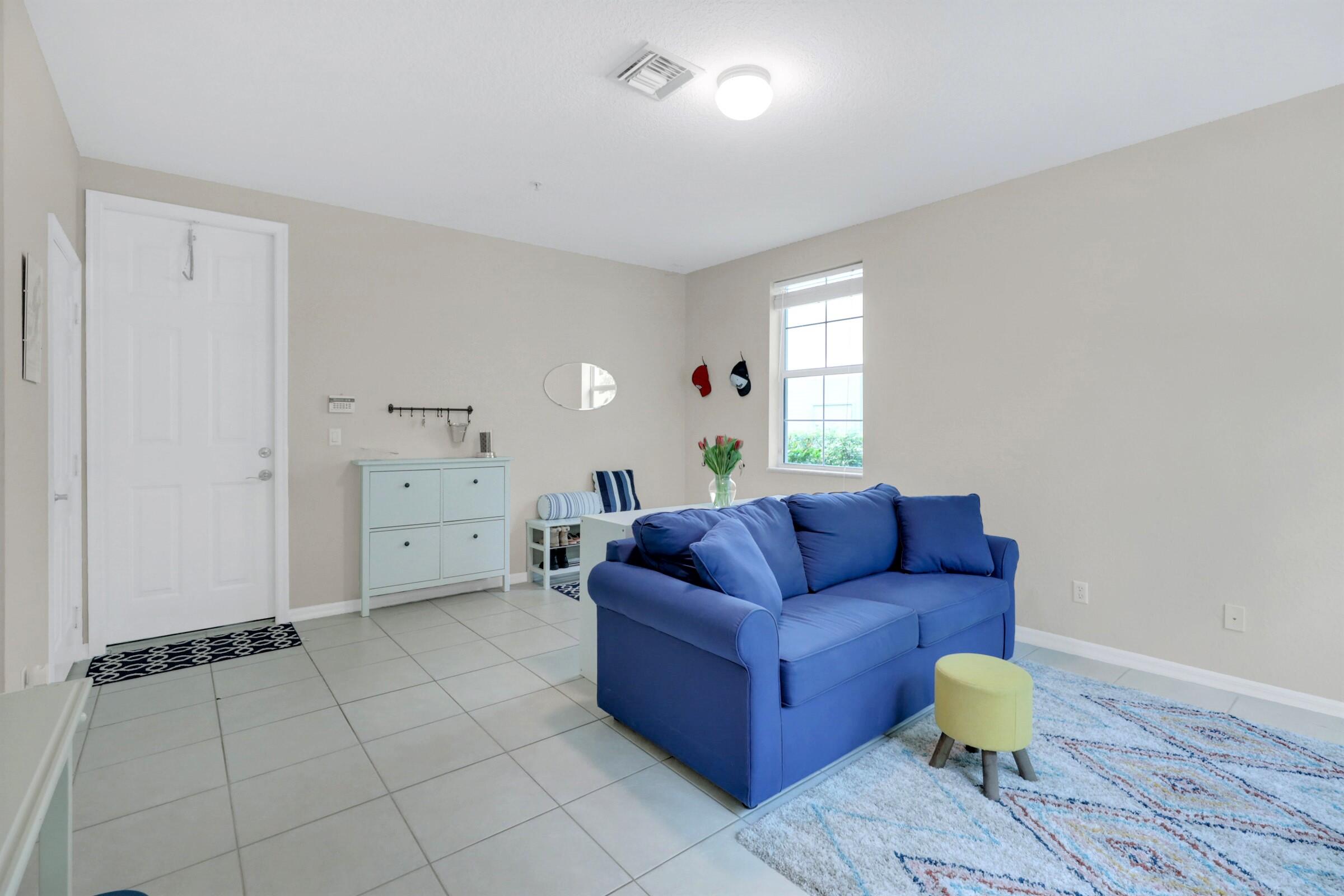 1582 Grande Cull Way Jupiter, FL 33458 - Photo 5 of 75 a living room with furniture and wooden floor
