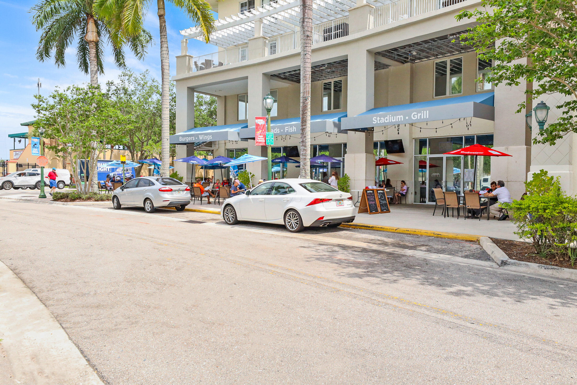 1582 Grande Cull Way Jupiter, FL 33458 - Photo 53 of 75 a car parked in front of a building