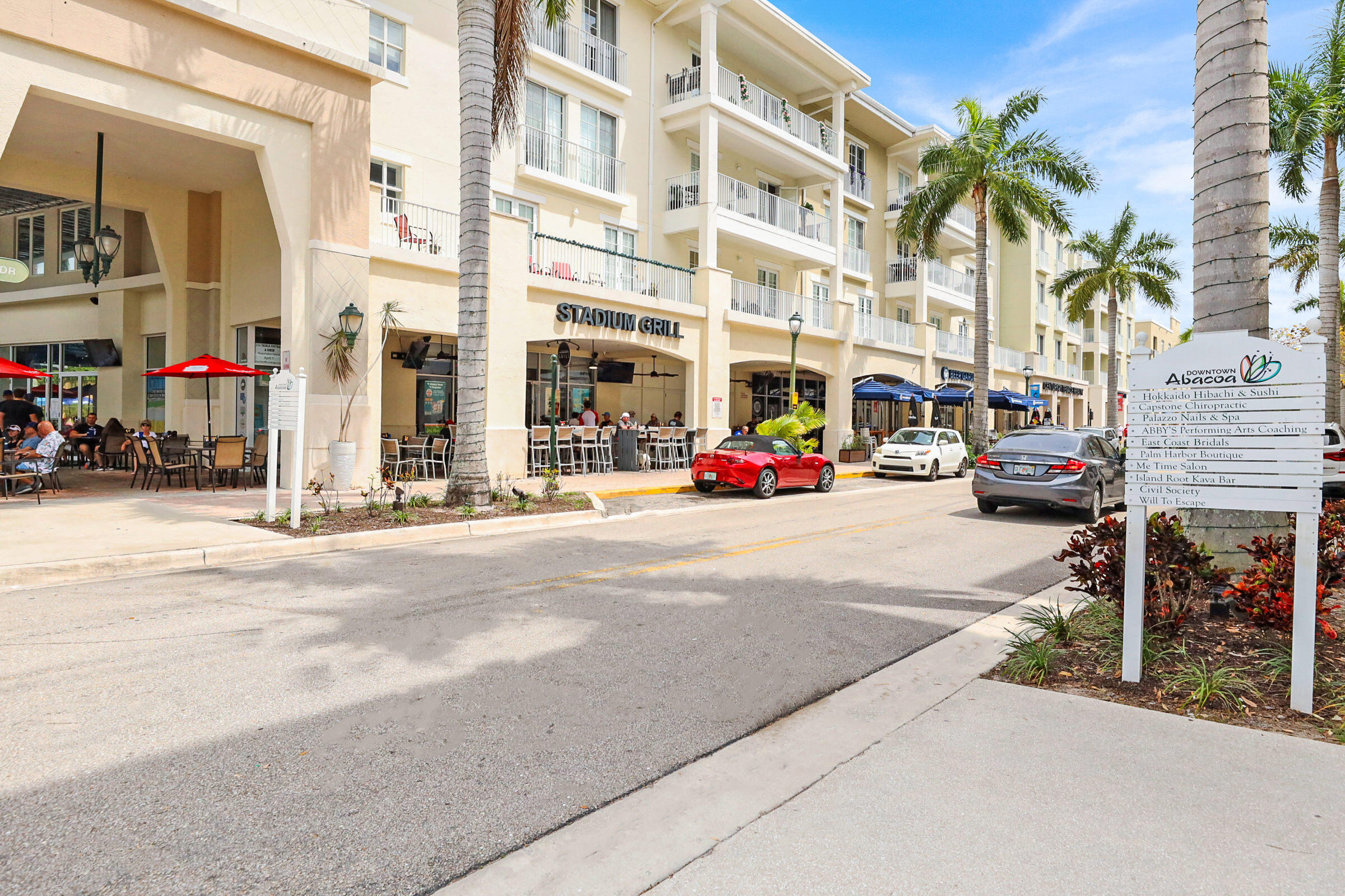 1582 Grande Cull Way Jupiter, FL 33458 - Photo 55 of 75 a car parked in front of a building