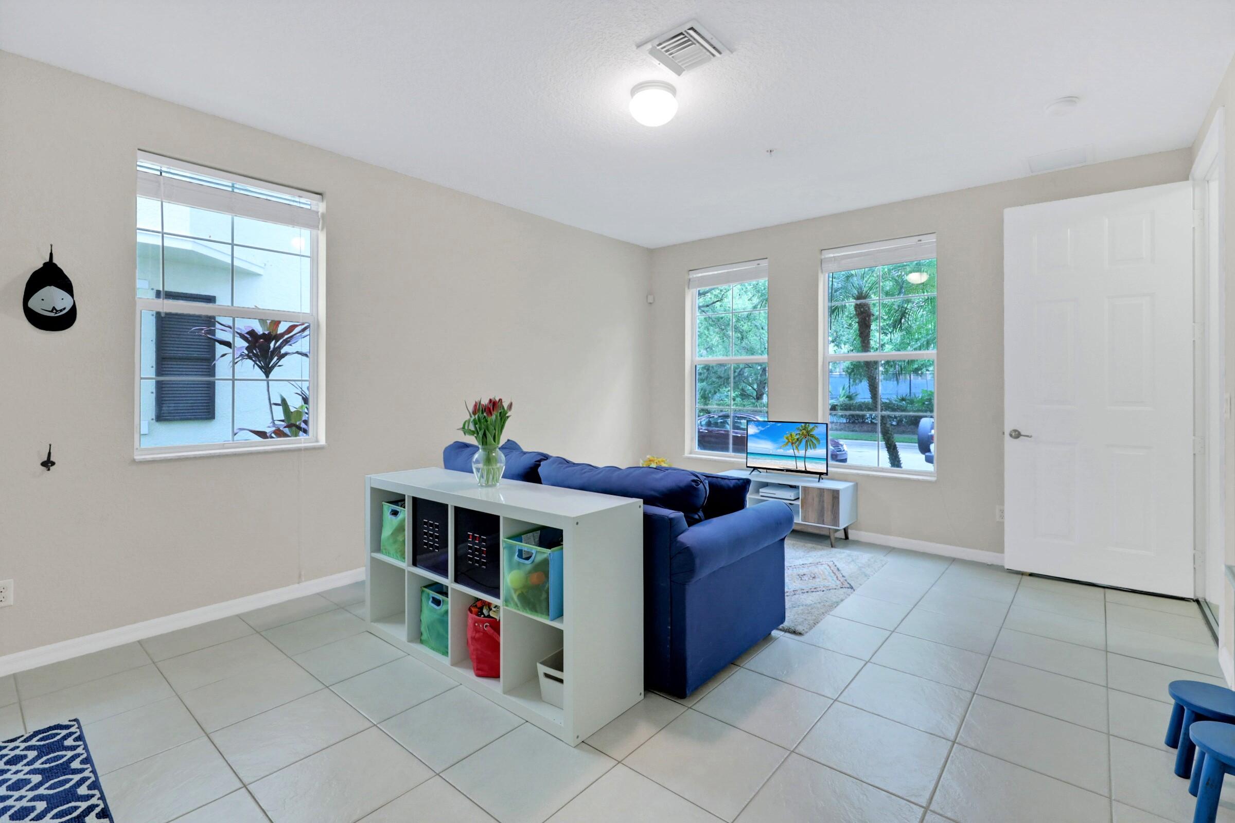 1582 Grande Cull Way Jupiter, FL 33458 - Photo 6 of 75 a living room with furniture and a window