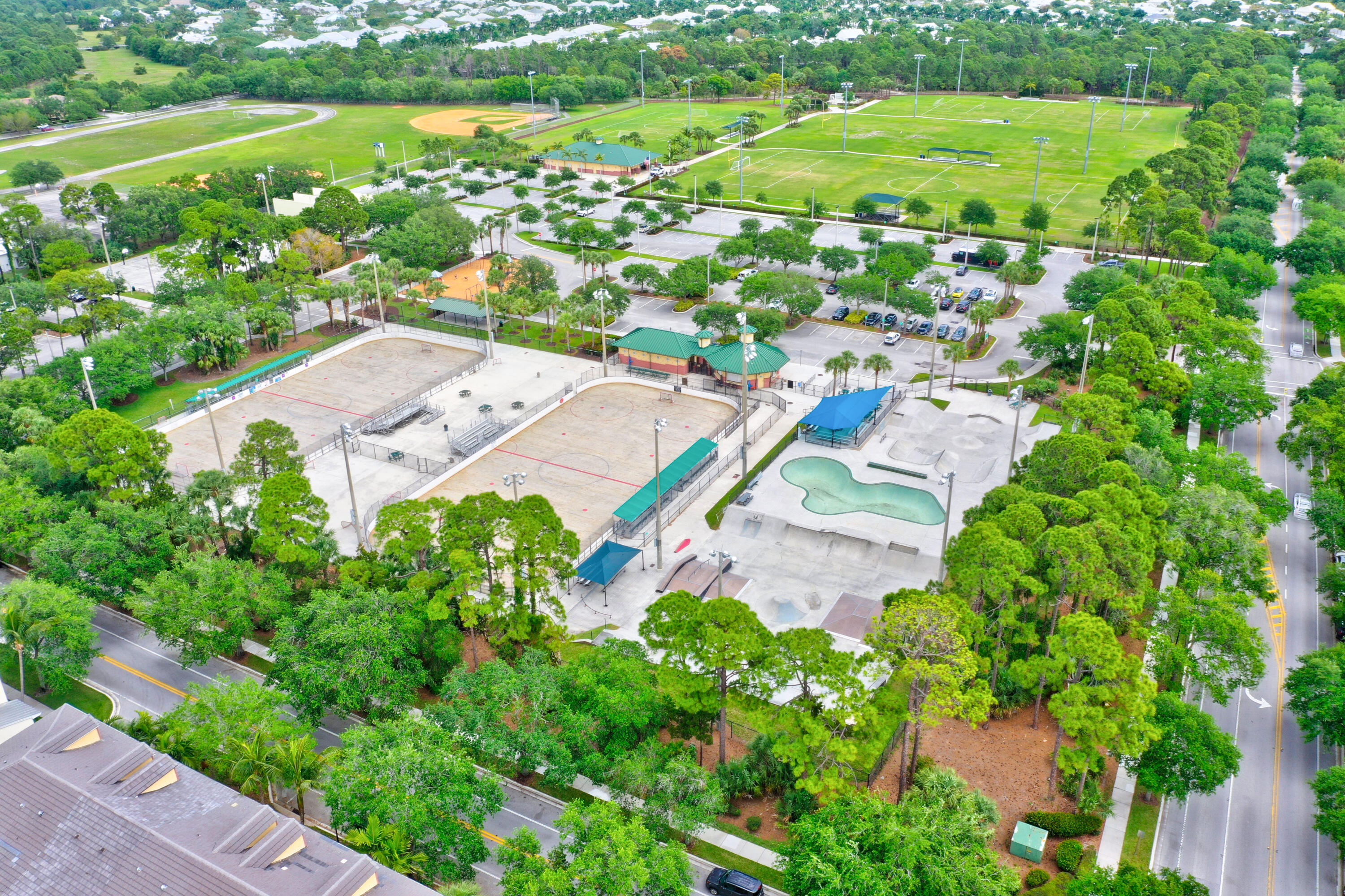 1582 Grande Cull Way Jupiter, FL 33458 - Photo 62 of 75 an aerial view of residential houses with outdoor space and trees all around