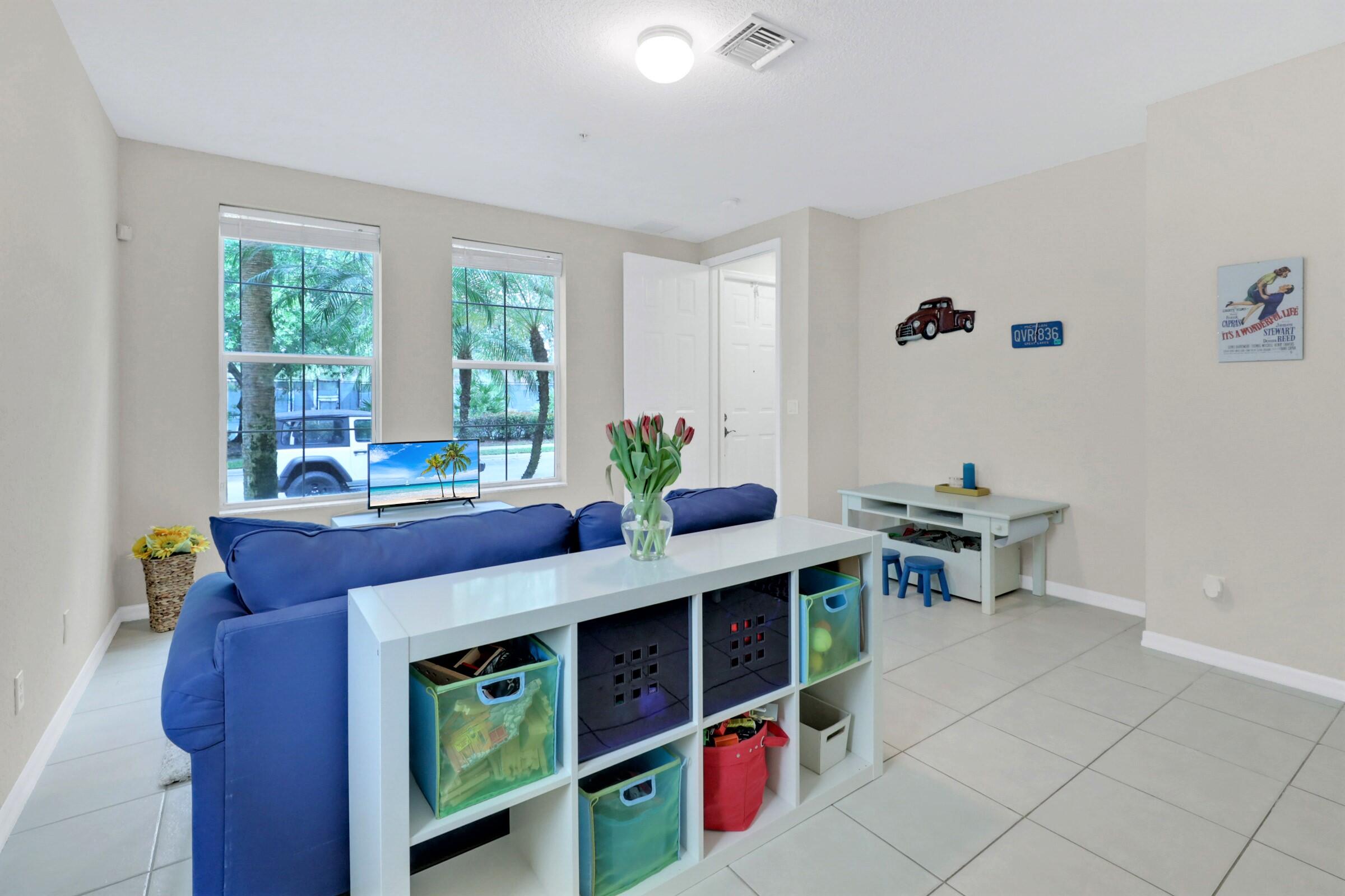 1582 Grande Cull Way Jupiter, FL 33458 - Photo 7 of 75 a view of a dining room with a table and chairs