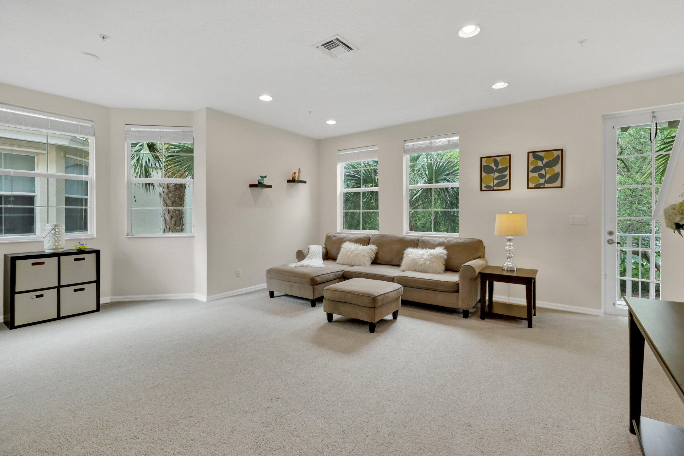 1582 Grande Cull Way Jupiter, FL 33458 - Photo 9 of 75 a living room with furniture and windows