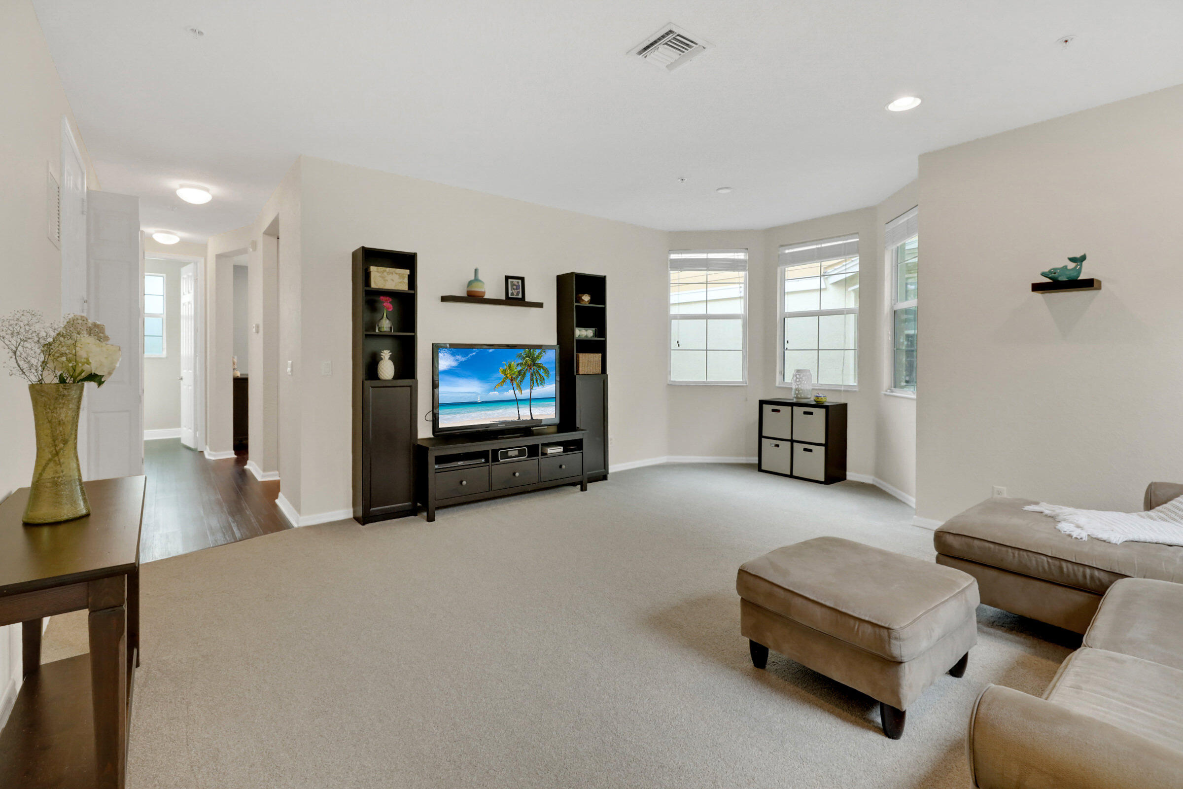1582 Grande Cull Way Jupiter, FL 33458 - Photo 10 of 75 a living room with furniture and a flat screen tv