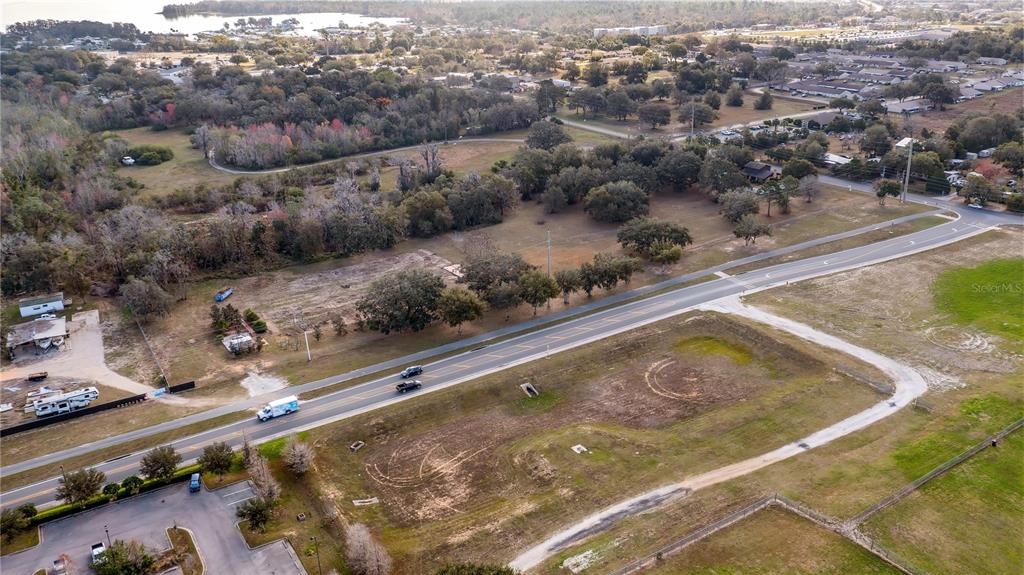 Woodlea Road Tavares, FL 32778 - Photo 29 of 63 a view of a swimming pool with a yard