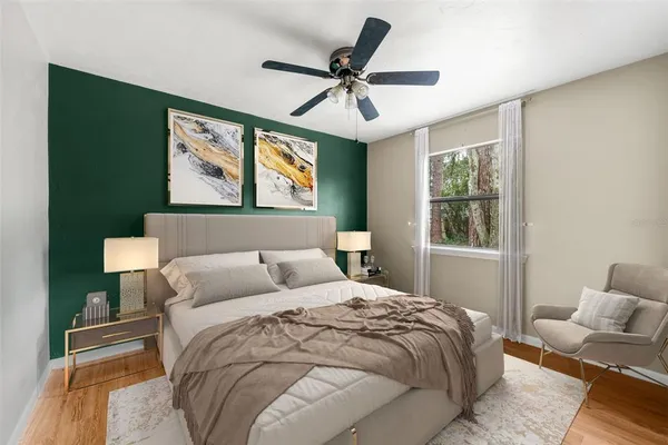 a bedroom with a bed and window