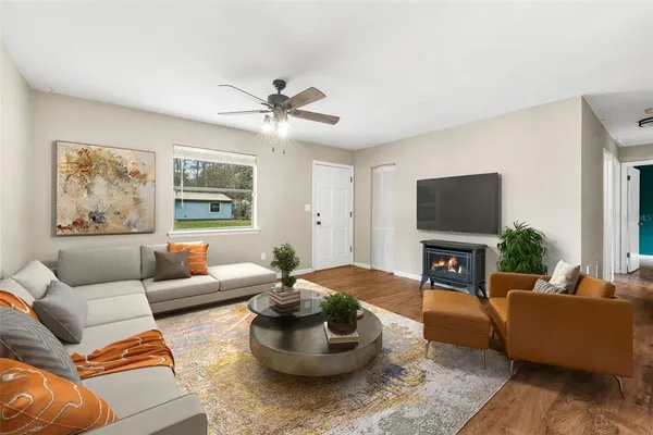 a living room with furniture and a fireplace