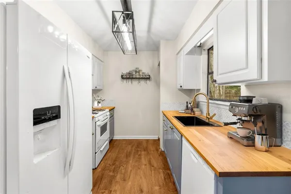 a kitchen that has a cabinets and a stove