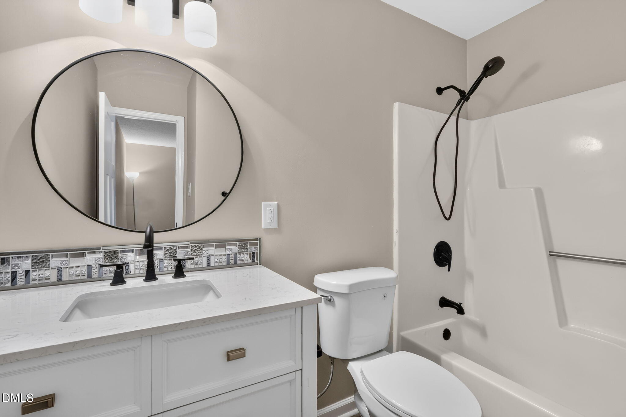3425 Mill Run Raleigh, NC 27612 - Photo 29 of 40 a bathroom with a sink a toilet and a mirror