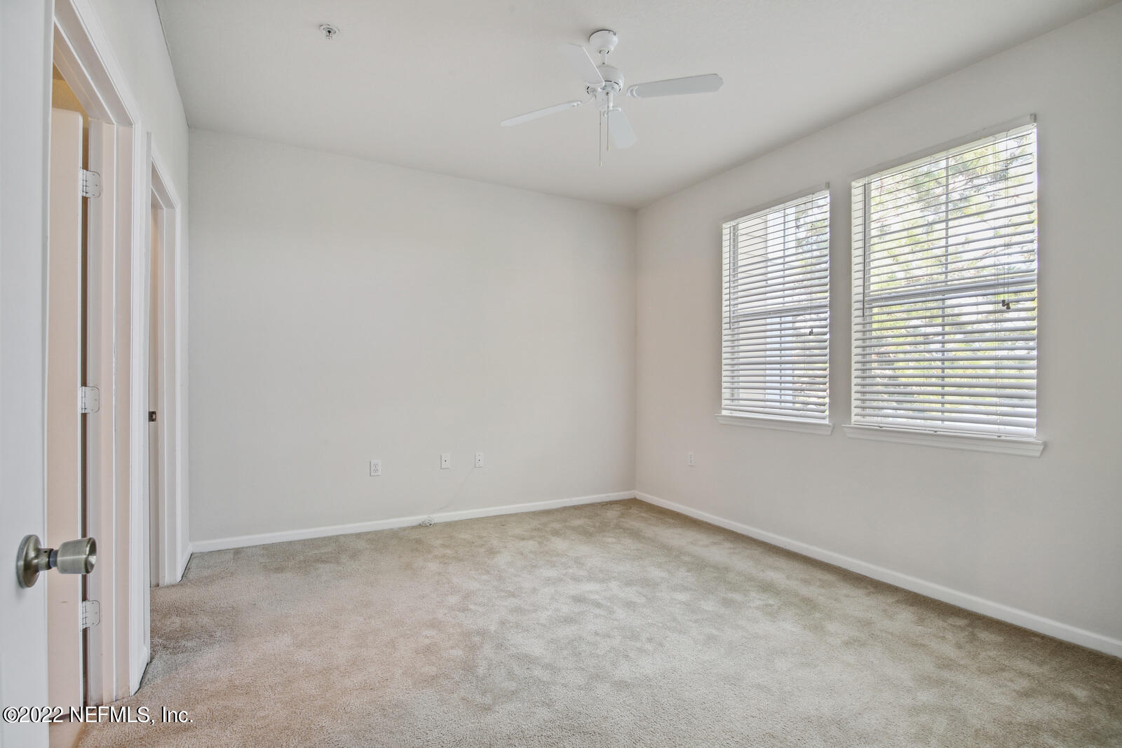 8550 Touchton Road, Unit 1438 Jacksonville, FL 32216 - Photo 12 of 37 a view of an empty room with a window