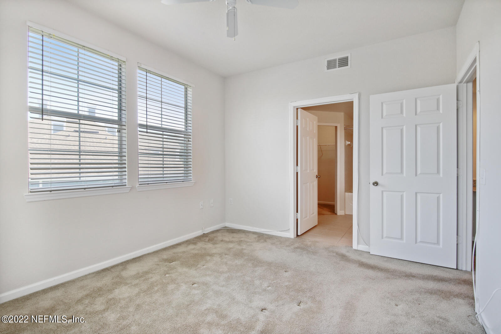 8550 Touchton Road, Unit 1438 Jacksonville, FL 32216 - Photo 17 of 37 a view of an empty room with a window