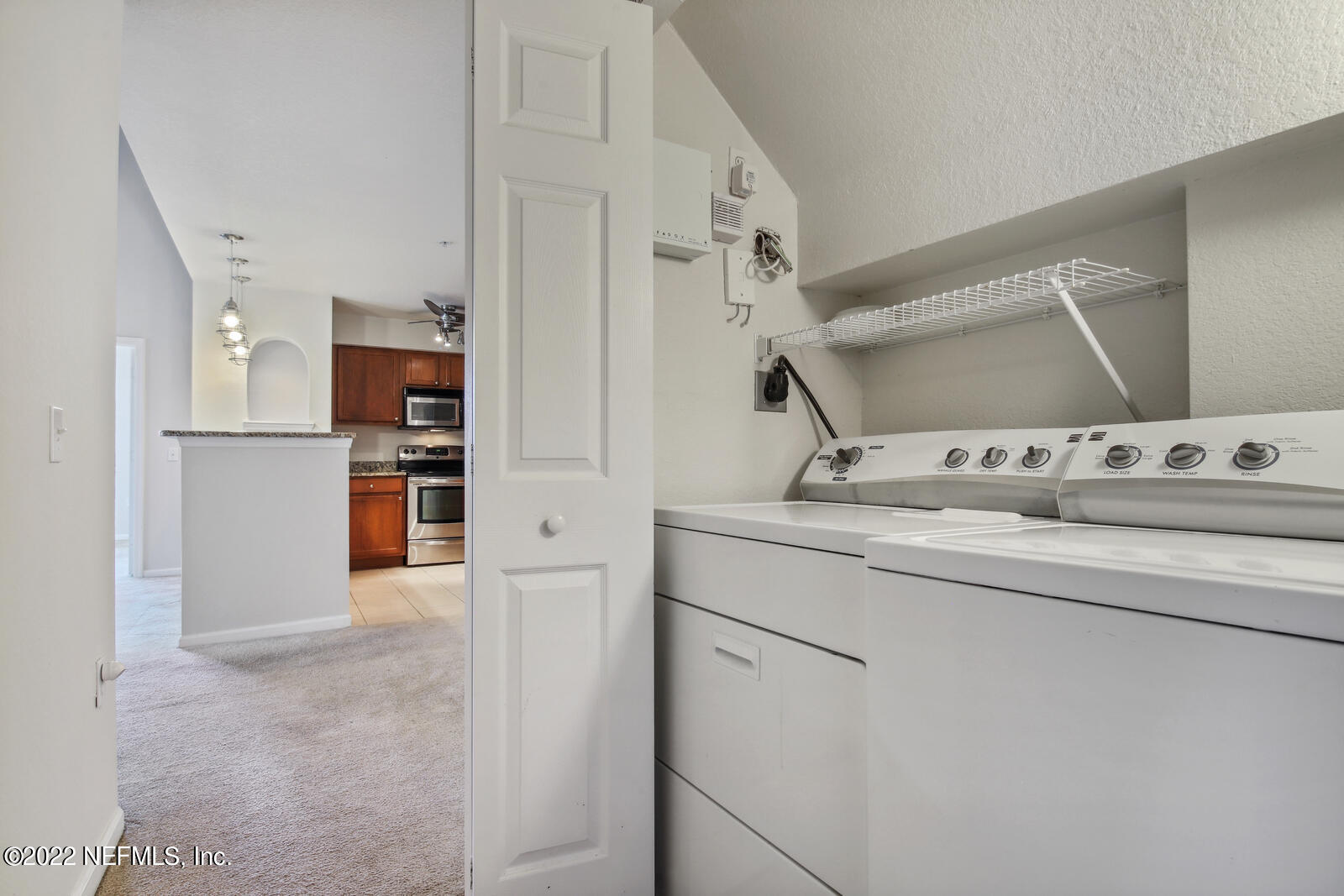 8550 Touchton Road, Unit 1438 Jacksonville, FL 32216 - Photo 22 of 37 a view of kitchen and wooden floor