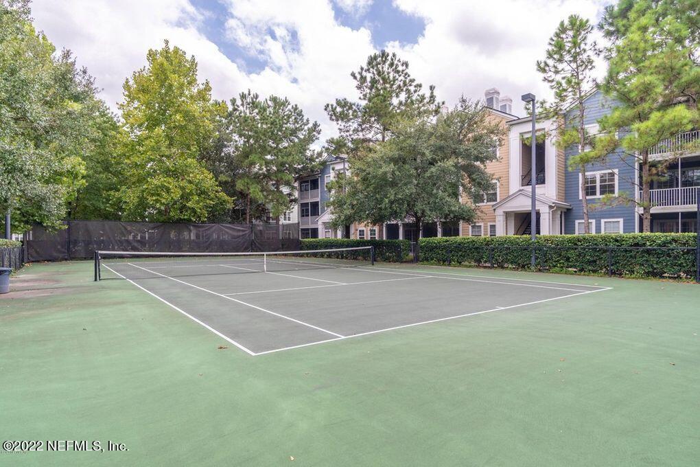 8550 Touchton Road, Unit 1438 Jacksonville, FL 32216 - Photo 35 of 37 a view of a tennis court