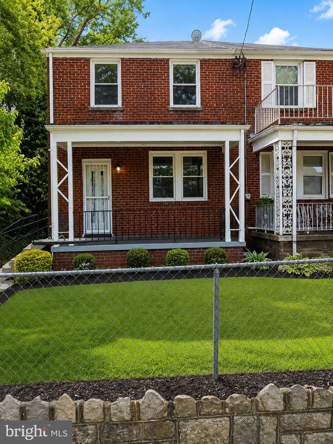 3921 S Street Southeast Washington, DC 20020 - Photo 1 of 2 a front view of a house with a yard