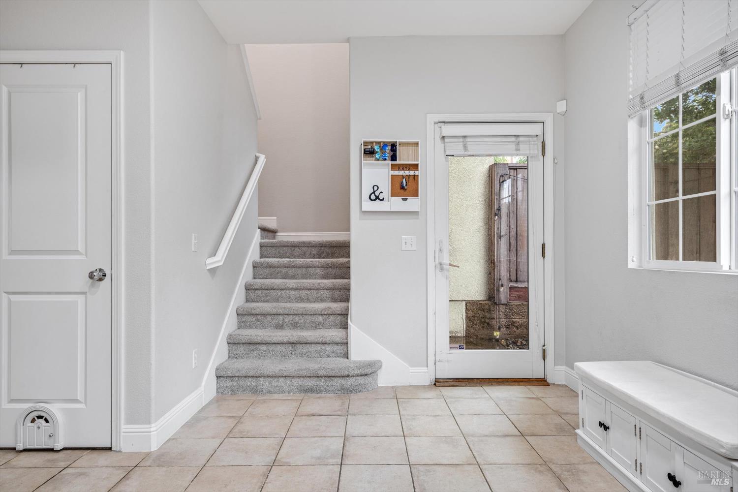 2084 Cooper Drive Santa Rosa, CA 95404 - Photo 11 of 37 Stairs to bedrooms, door to private back yard, and additional storage under the stairs.