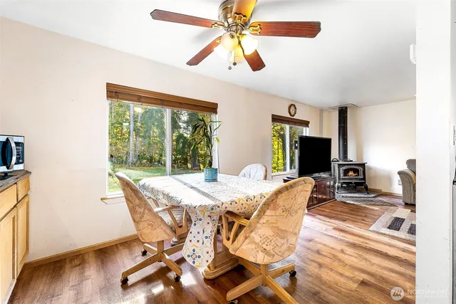 a view of a dining room with furniture window and wooden floor