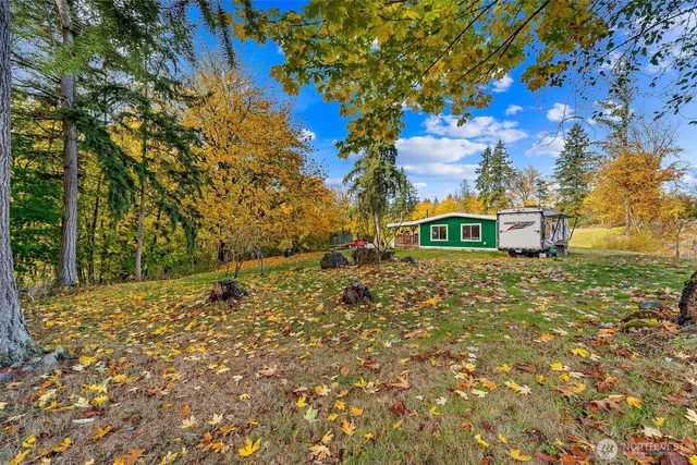 a view of a house with a yard