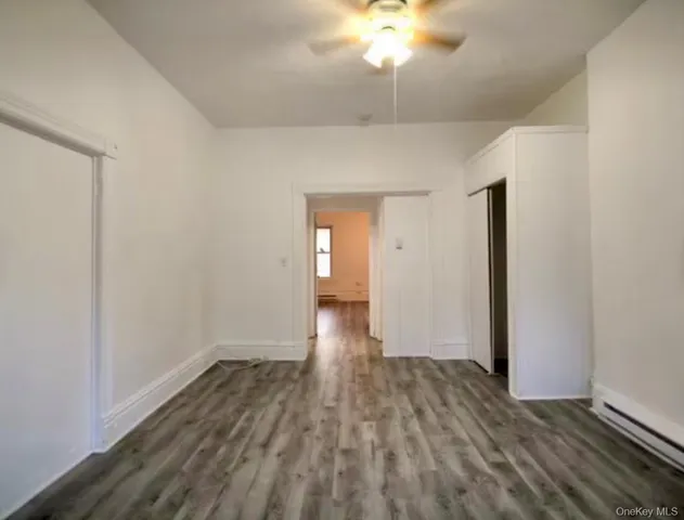 a view of wooden floor and chandelier in a room