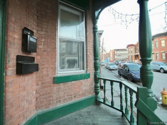 a view of balcony with furniture