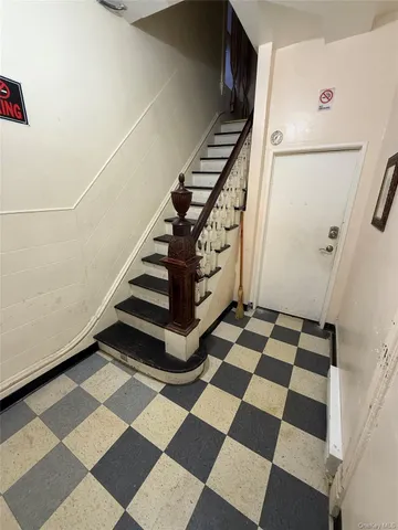 a view of entryway with wooden floor