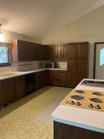 298 Haydenville Road Whately, MA 01093 - Photo 15 of 33 a kitchen with wooden cabinets and a sink