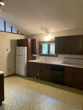 298 Haydenville Road Whately, MA 01093 - Photo 16 of 33 a kitchen with a sink and a refrigerator