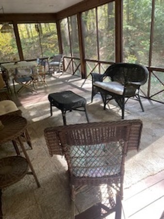 298 Haydenville Road Whately, MA 01093 - Photo 19 of 33 a living room with furniture and a floor to ceiling window