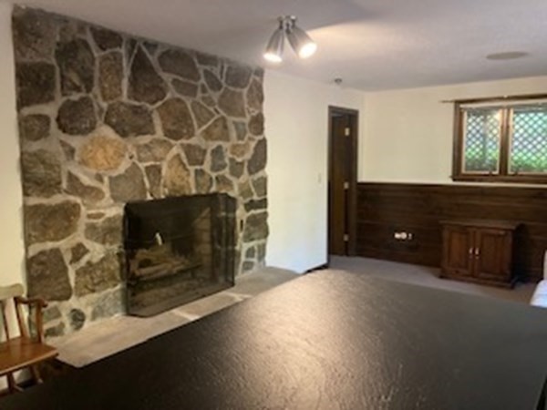 298 Haydenville Road Whately, MA 01093 - Photo 22 of 33 a living room with a fireplace and a large window