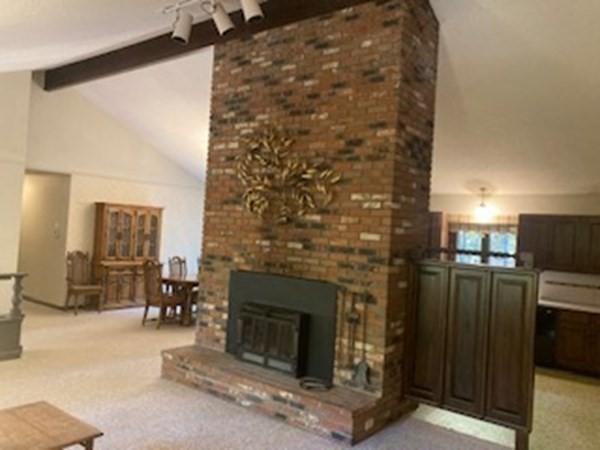 298 Haydenville Road Whately, MA 01093 - Photo 9 of 33 a living room with furniture and a fireplace