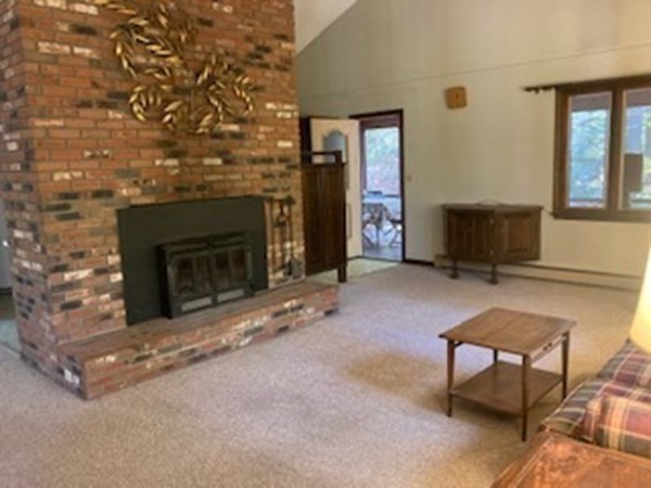 298 Haydenville Road Whately, MA 01093 - Photo 10 of 33 a living room with furniture and a fireplace