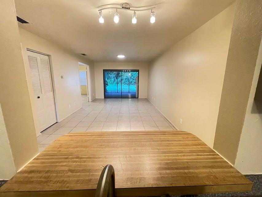 6026 Indrio Road, Unit N6 Fort Pierce, FL 34951 - Photo 1 of 34 a view of livingroom with wooden floor