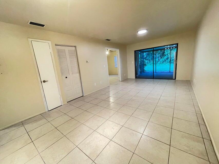 6026 Indrio Road, Unit N6 Fort Pierce, FL 34951 - Photo 13 of 34 a view of an empty room and wooden floor