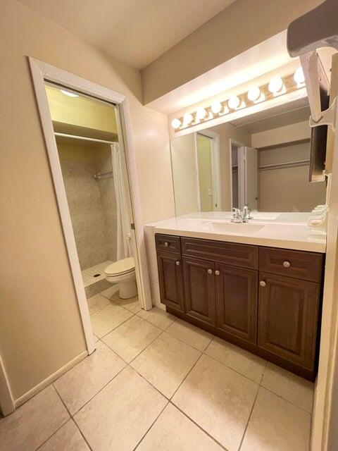 6026 Indrio Road, Unit N6 Fort Pierce, FL 34951 - Photo 23 of 34 a spacious bathroom with a double vanity sink and a mirror