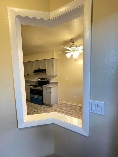 6026 Indrio Road, Unit N6 Fort Pierce, FL 34951 - Photo 5 of 34 a view of a kitchen from the hallway