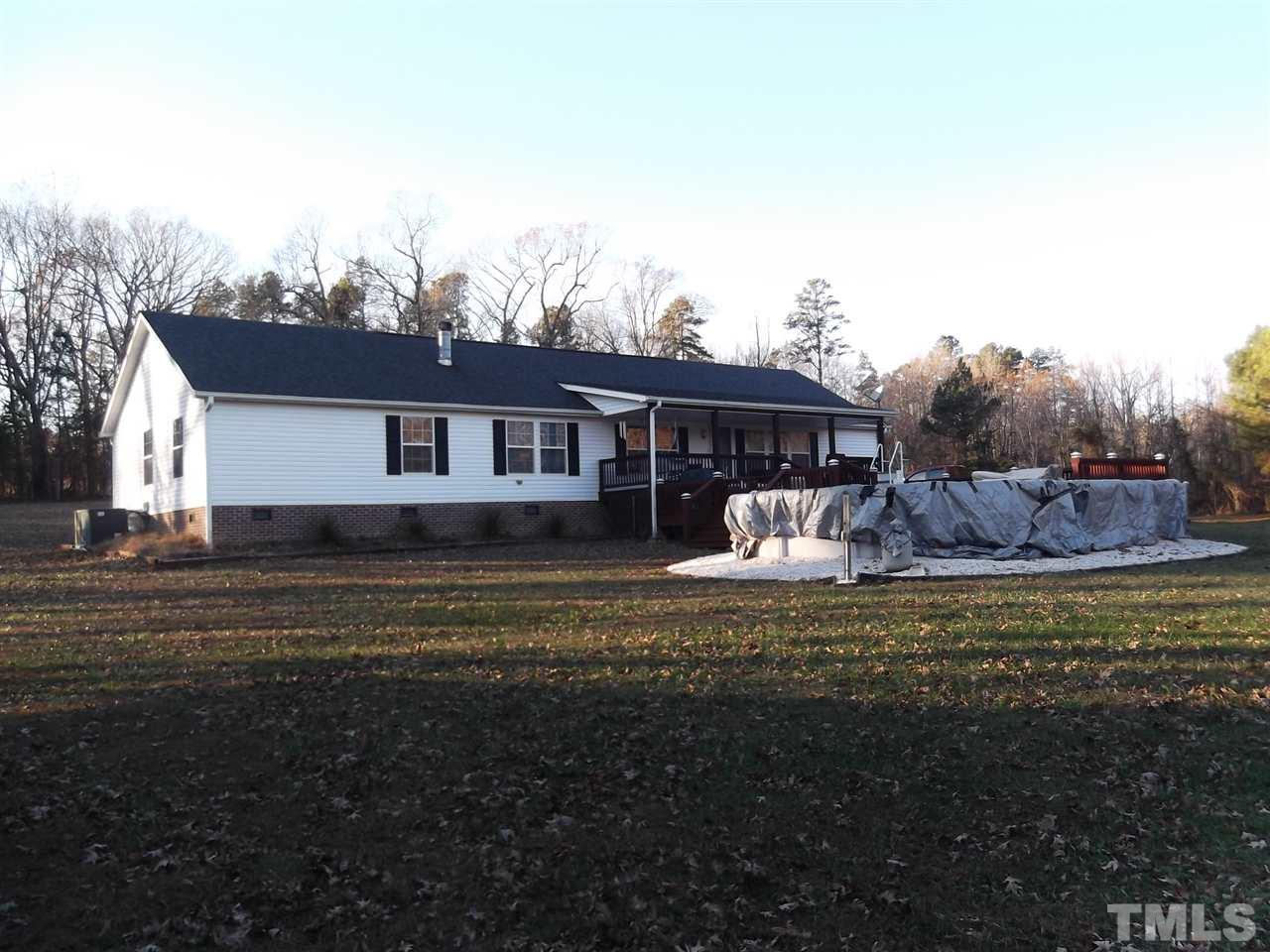 299 J C Lunsford Road Roxboro, NC 27574 - Photo 3 of 25 a front view of a house with a garden