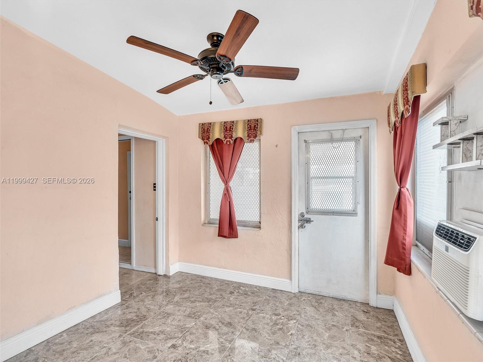 10 Southwest 72nd Avenue Miami, FL 33144 - Photo 11 of 35 a view of a hallway with closet and a chandelier fan