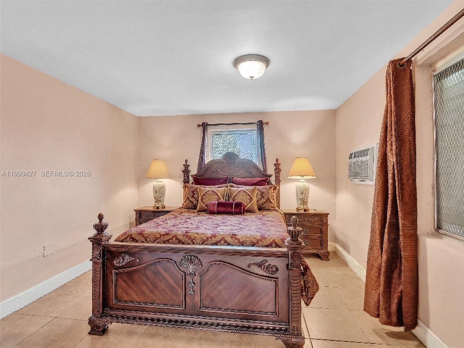 10 Southwest 72nd Avenue Miami, FL 33144 - Photo 14 of 35 a bedroom with a bed and a mirror